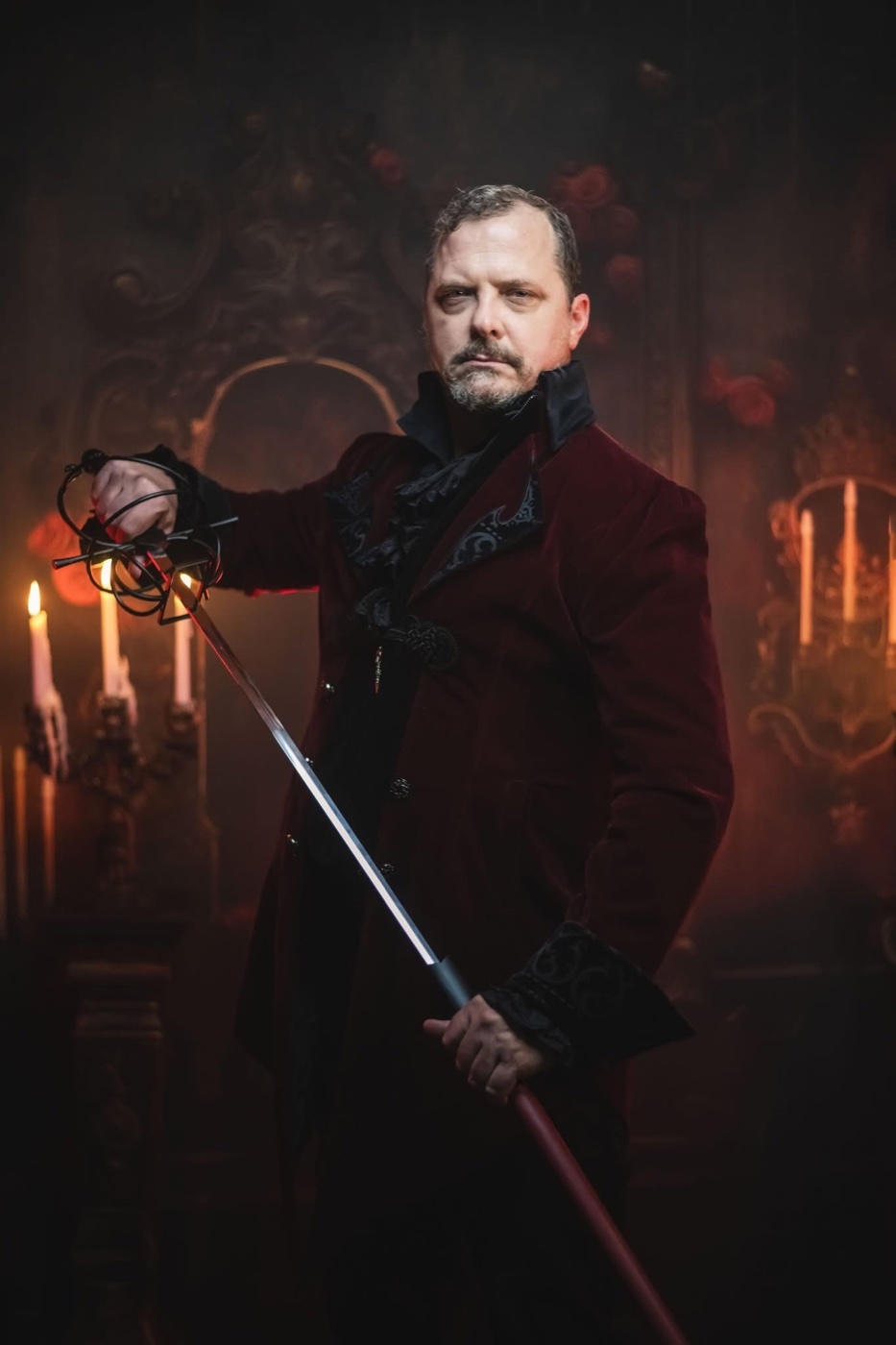James Liggett as Jareth in a burgundy coat